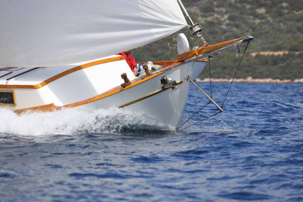 istock Close up on the bow of a sailboat breaking through a wave 1391305666