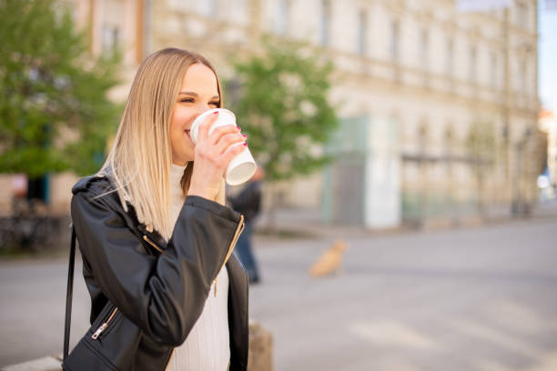 istock Young woman smiling at sunset 1391305712