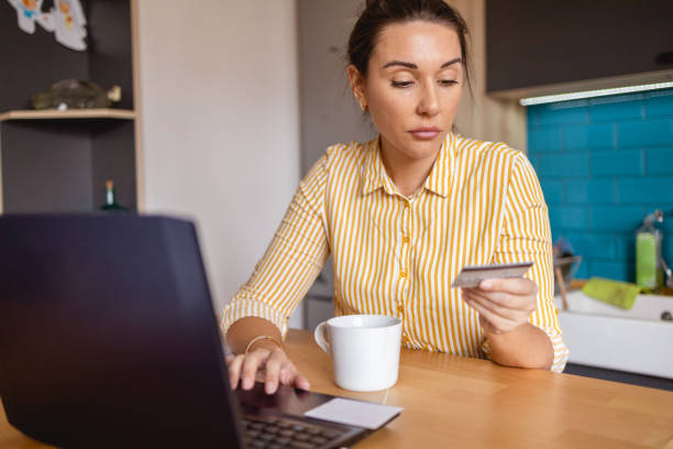 istock Woman Doing Finances at Home 1391305746