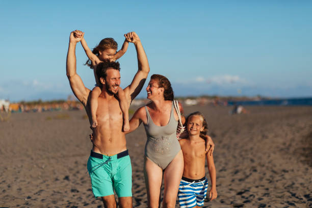 istock A family walks on the beach 1391309563