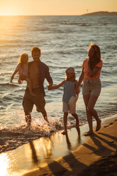 istock Playful family on the beach 1391309601