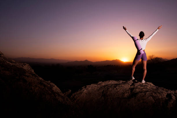 istock Female Fitness outdoors on rocks 1391309633