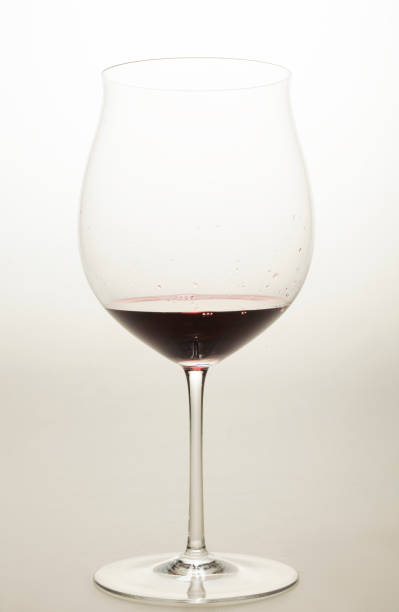 istock red wine in a special glass on a light background in a studio without people close-up 1391310926