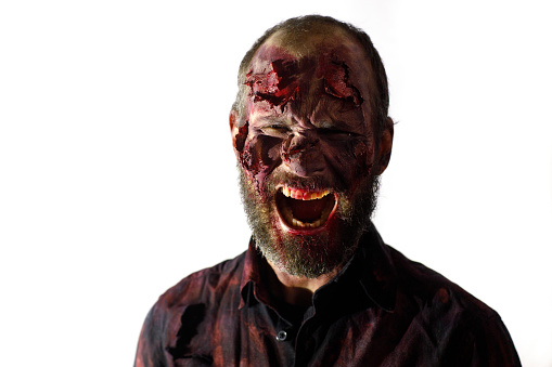 Zombie male makeup for halloween concept on white background