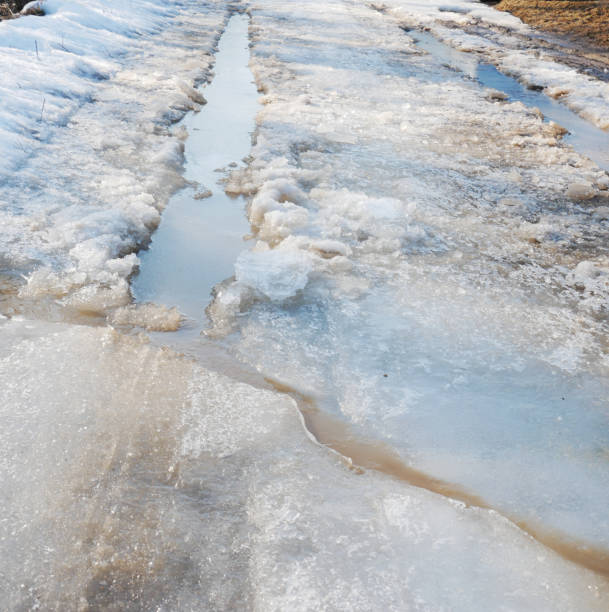 istock Country roud covered with snow and ice. 1391314908