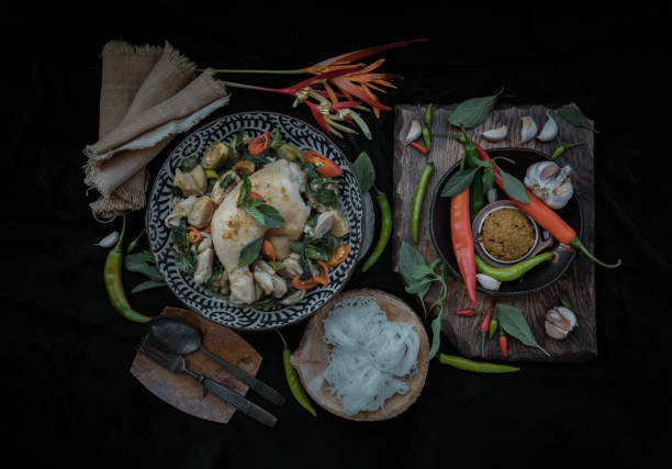 istock Green curry with Chicken and Thai eggplants (Kaeng khiao wan) in Ceramic bowl served with Rice noodles. 1391315135