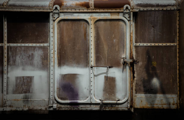istock Metal locked padlock at Vintage railroad container doors gates. 1391315156