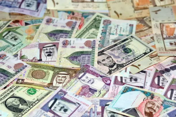 American dollars and Egyptian pounds banknotes money with Saudi Arabia riyals money banknotes, selective focus of Saudi Arabia money riyals, USA dollars and Egyptian money exchange rates
