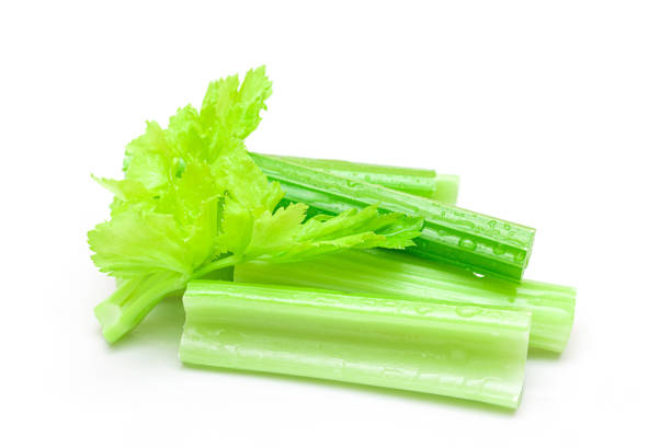 istock Fresh Chopped Celery Sticks with Water Drops Isolated on White Background 1391323800