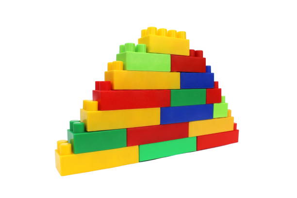 istock Bright multi-colored cubes of the designer scattered lie on a white isolated background. 1391335057