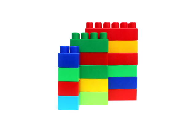 Bright multi-colored cubes of the designer scattered lie on a white isolated background.