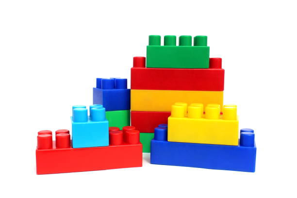 istock Bright multi-colored cubes of the designer scattered lie on a white isolated background. 1391335286