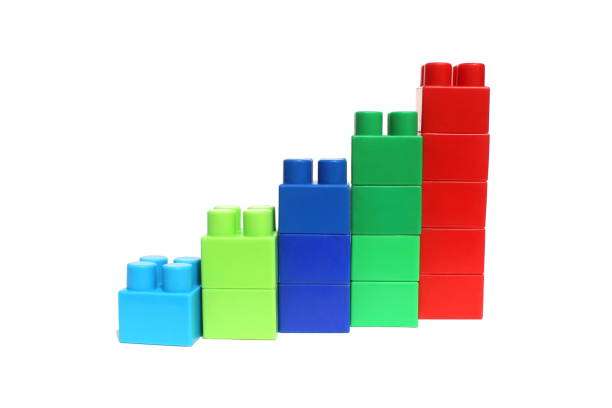 istock Bright multi-colored cubes of the designer scattered lie on a white isolated background. 1391335314