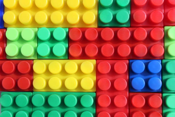 istock Texture of stacked bright, colorful constructor parts 1391335391
