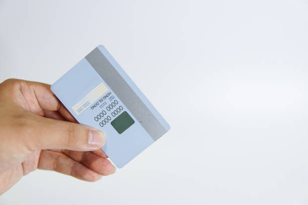 istock a hand holding a credit card 1391338316