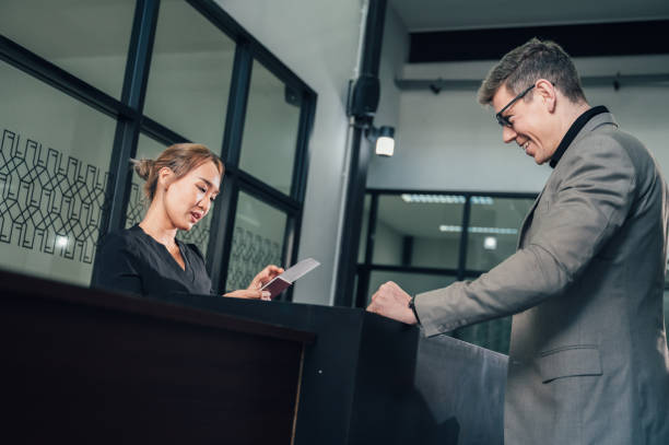 istock Multiracial people standing in queue to check in in airport hall 1391342847