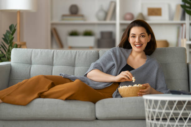 istock woman watching TV 1391342853