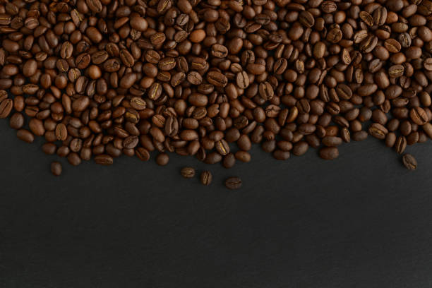 istock Coffee beans on a black background. Top view. Copy space 1391347441