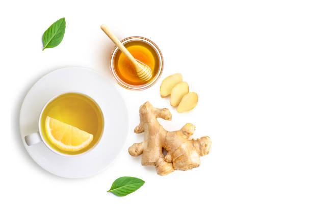istock Ginger tea with lemon honey and mint leaf isolated on white 1391348368