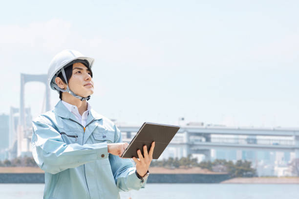 istock Construction workers against the backdrop of the city 1391350930