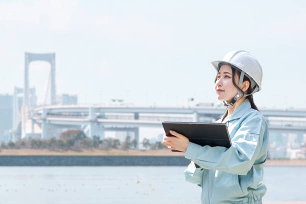 istock Construction workers against the backdrop of the city 1391350938
