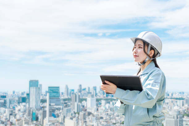 istock Construction workers against the backdrop of the city 1391350942