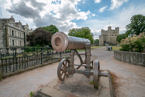 Crimean War Cannon at Rochester Castle in Kent, England. This was captured from the Russians during that war (1853-1856) and given to the city of Rochester, finally arriving in 1859. In the background is Rochester Castle.
