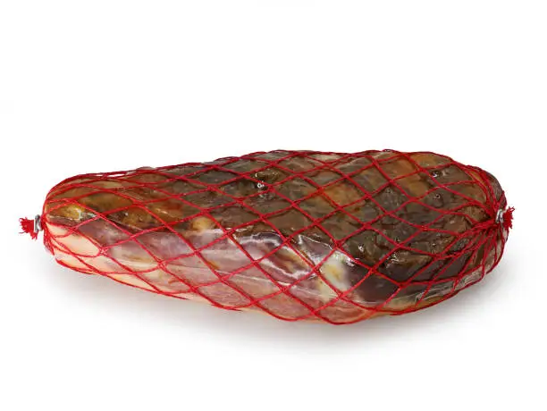 Photo of spanish ham wrapped in foil and net isolated on white background