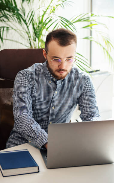 istock Businessman working on his laptop in an office 1391360104