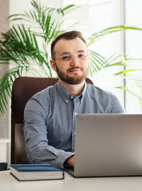 istock Businessman working on his laptop in an office 1391360110