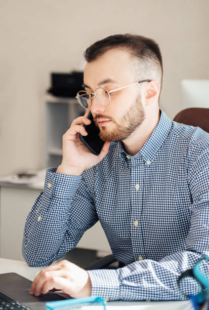 istock Businessman working on his laptop in an office 1391360113