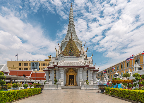 Bangkok, Thailand - Mar 29, 2022: The beautiful white temple of  Bangkok City Pillar Shrine or Wat Lak Muang, one of the famous historical landmarks.