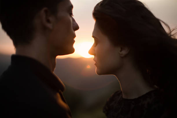 istock Silhouette sweethearts at sunset 1391364676