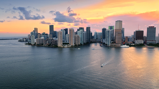 Aerial view of downtown Miami and Brickell Key island during sunset in Florida, USA.