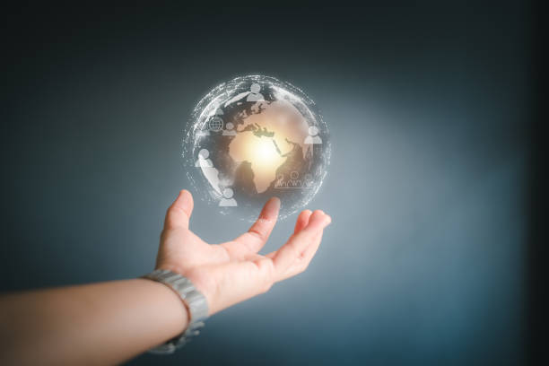 istock hand holding a Earth globle in technology concept. 1391365975