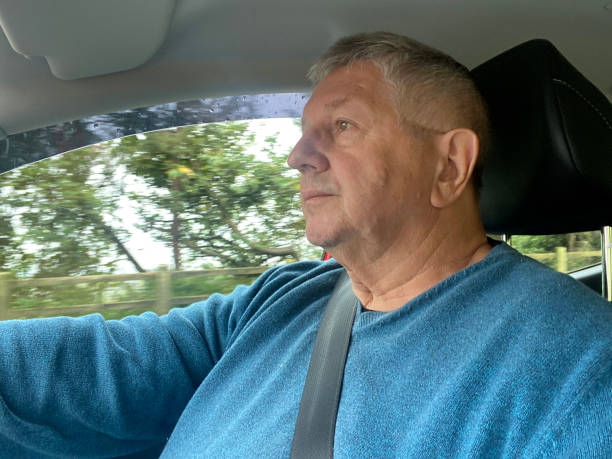 istock Senior man driving in car 1391367968