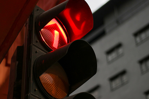 Portrait shot of the traffic light (RED) on the street