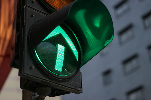 Portrait shot of the traffic light (GREEN) on the street