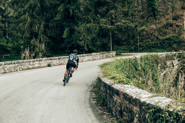 istock rear view of a cyclist on the road 1391369294