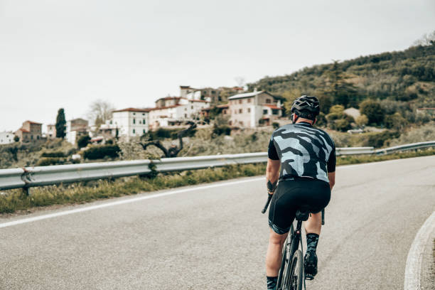 istock rear view of a cyclist on the road 1391369309