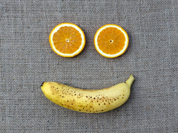 istock Two orange slices and banana 1391369316