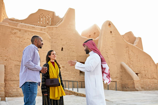 istock Guide talking with tourists while visiting At-Turaif ruins 1391369783
