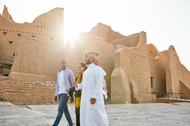 istock Visitors and guide exploring At-Turaif open air museum 1391369786