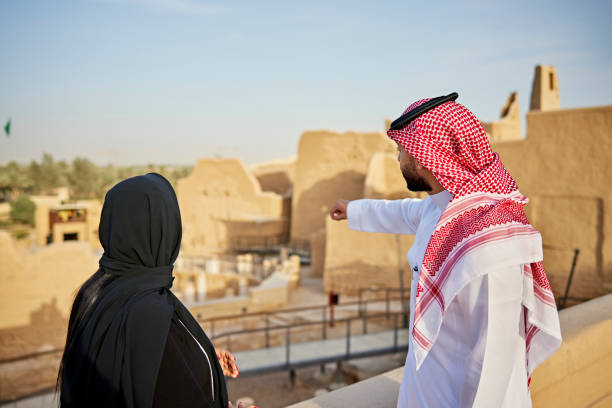 istock Saudi couple looking at museum’s archaeological ruins 1391369815