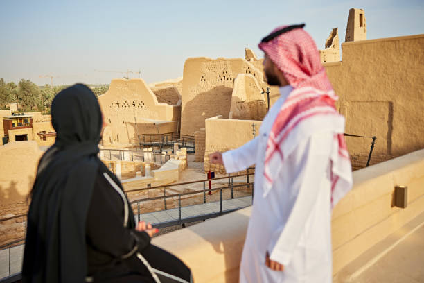 istock Relaxed Riyadh couple looking at open air museum ruins 1391369818