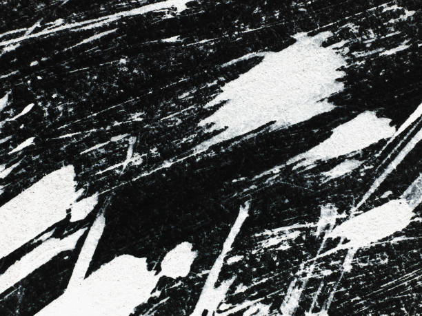 Patterns of white paint from a brush on a black background Patterns Abstract texture or background wall. white paint pattern over black. scuff marks photos stock pictures, royalty-free photos & images