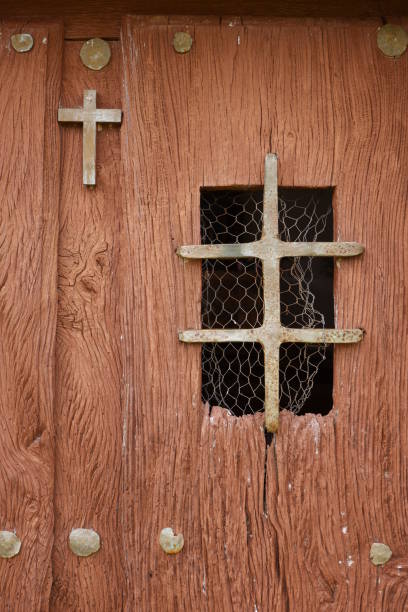 Old church door with a metal cross