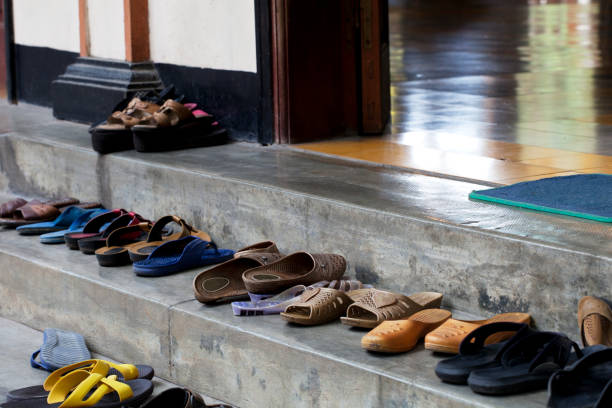 Shoes at the entrance of a Hinduist temple stock photo