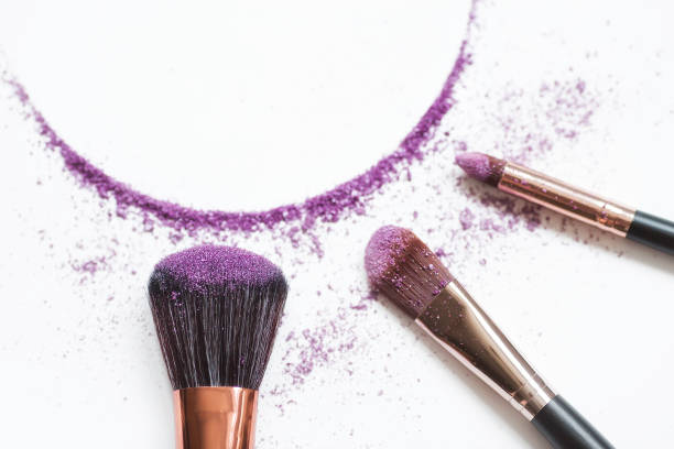 istock Eye shadow and makeup brush highlighted on a white background. A frame for the beauty industry. The concept of beauty and self-care. 1391376350