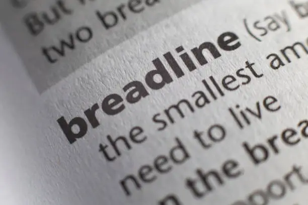 The word breadline printed and defined in an English dictionary